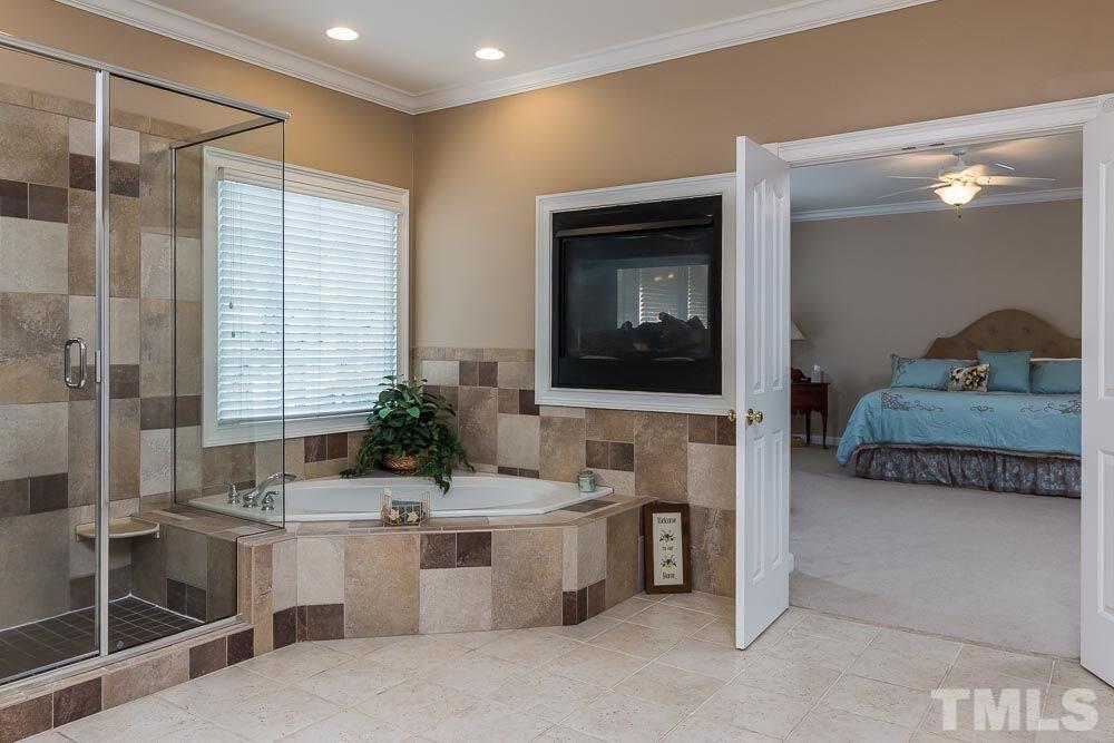3920 Bentley Bridge Road Raleigh, NC 27612 - Photo 14 of 20 a living room with stainless steel appliances kitchen island granite countertop furniture and a view of bedroom