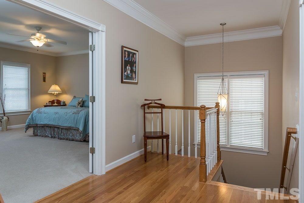 3920 Bentley Bridge Road Raleigh, NC 27612 - Photo 15 of 20 a bedroom with furniture and a window
