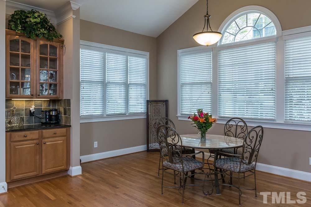3920 Bentley Bridge Road Raleigh, NC 27612 - Photo 19 of 20 a view of a dining room with furniture and chandelier