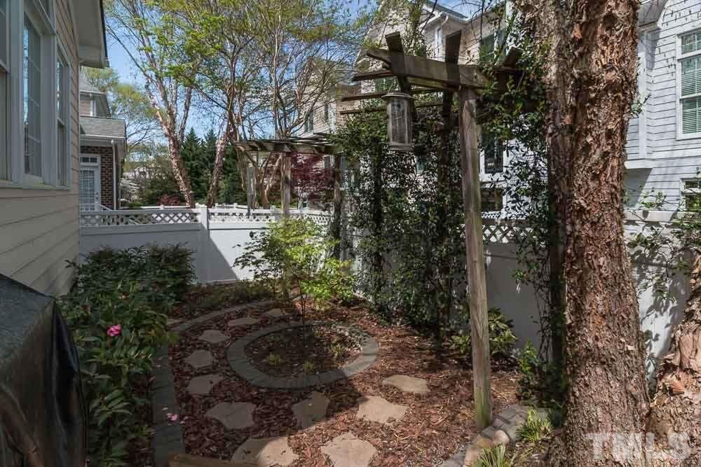 3920 Bentley Bridge Road Raleigh, NC 27612 - Photo 5 of 20 a view of a garden with pathway