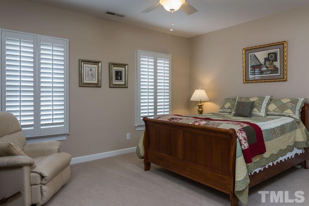 3920 Bentley Bridge Road Raleigh, NC 27612 - Photo 7 of 20 a bedroom with a bed and window