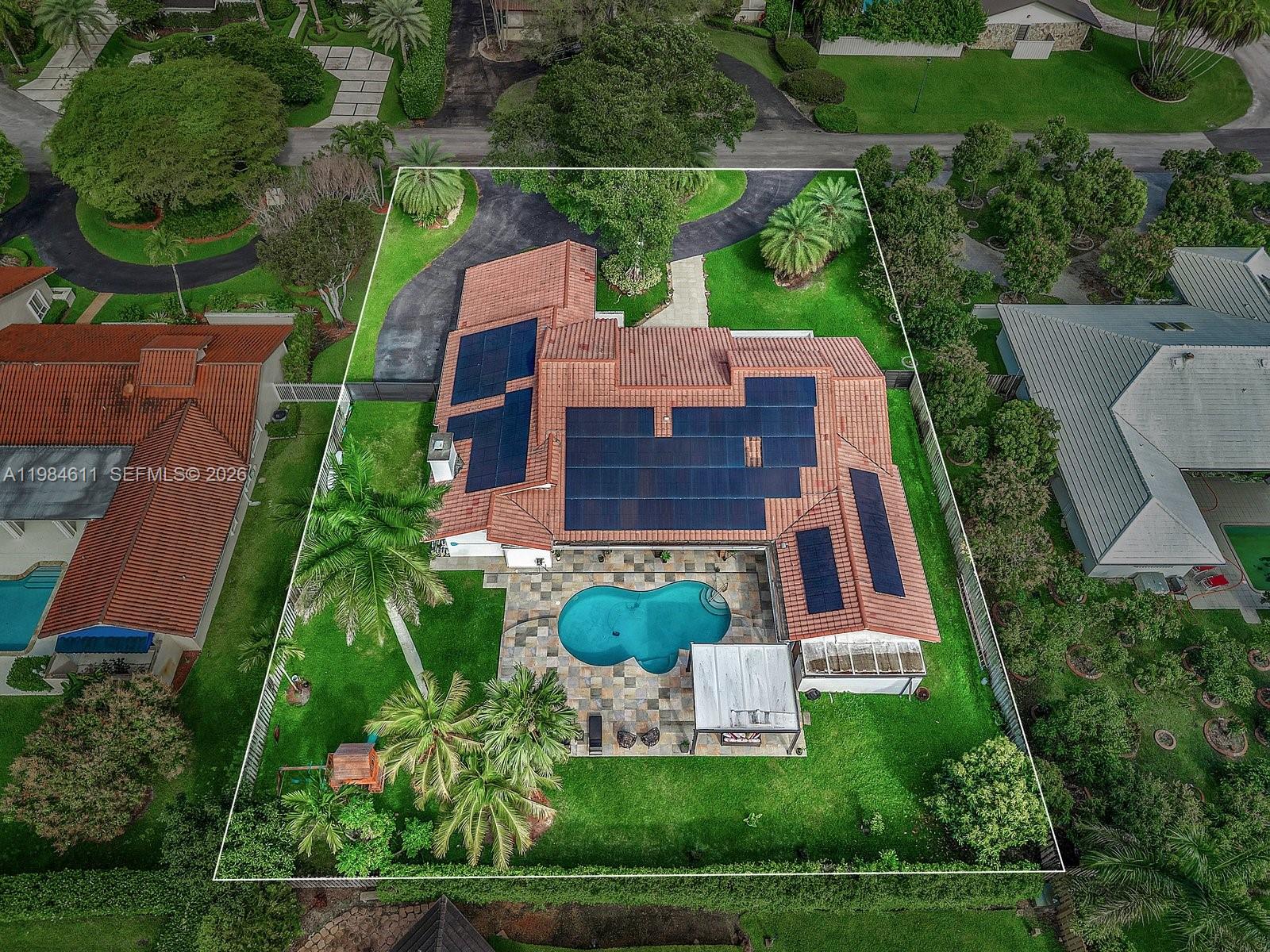 10126 Southwest 93rd Place Miami, FL 33176 - Photo 1 of 27 an aerial view of a house with a garden and trees