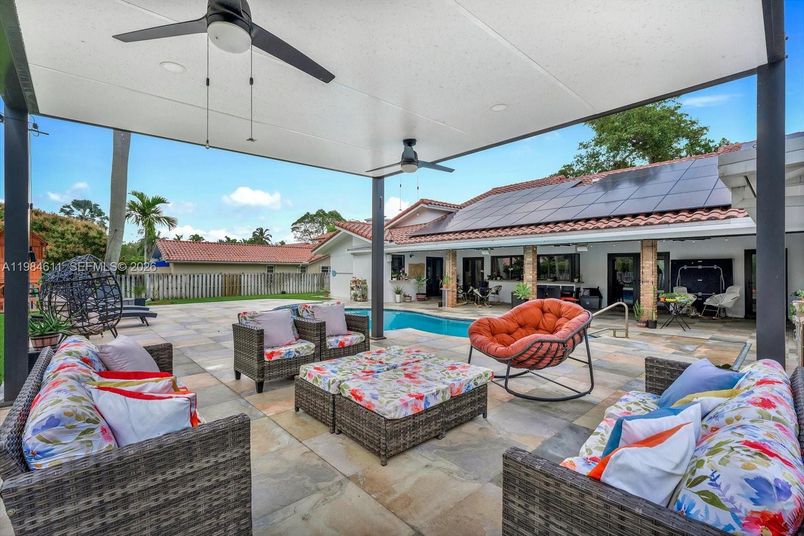 10126 Southwest 93rd Place Miami, FL 33176 - Photo 14 of 27 a outdoor living space with furniture and garden view