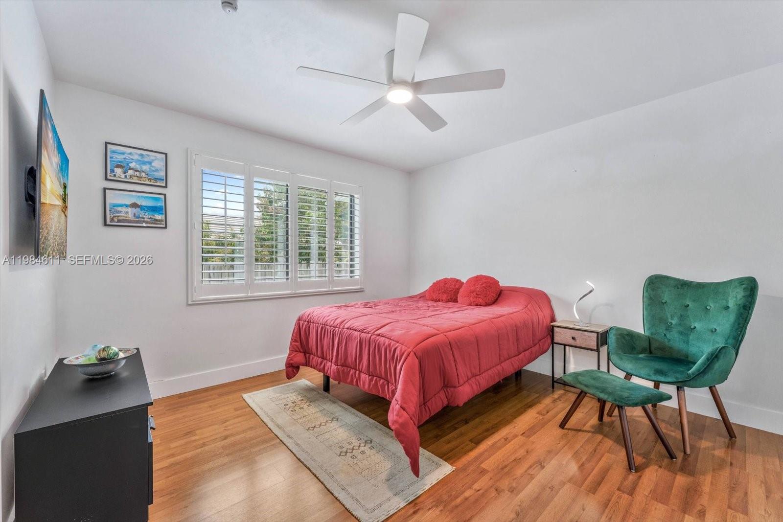 10126 Southwest 93rd Place Miami, FL 33176 - Photo 19 of 27 a bed room with a bed and a chair