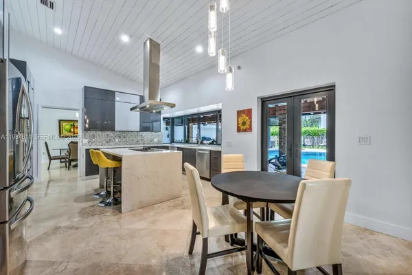a kitchen with a stove and a refrigerator