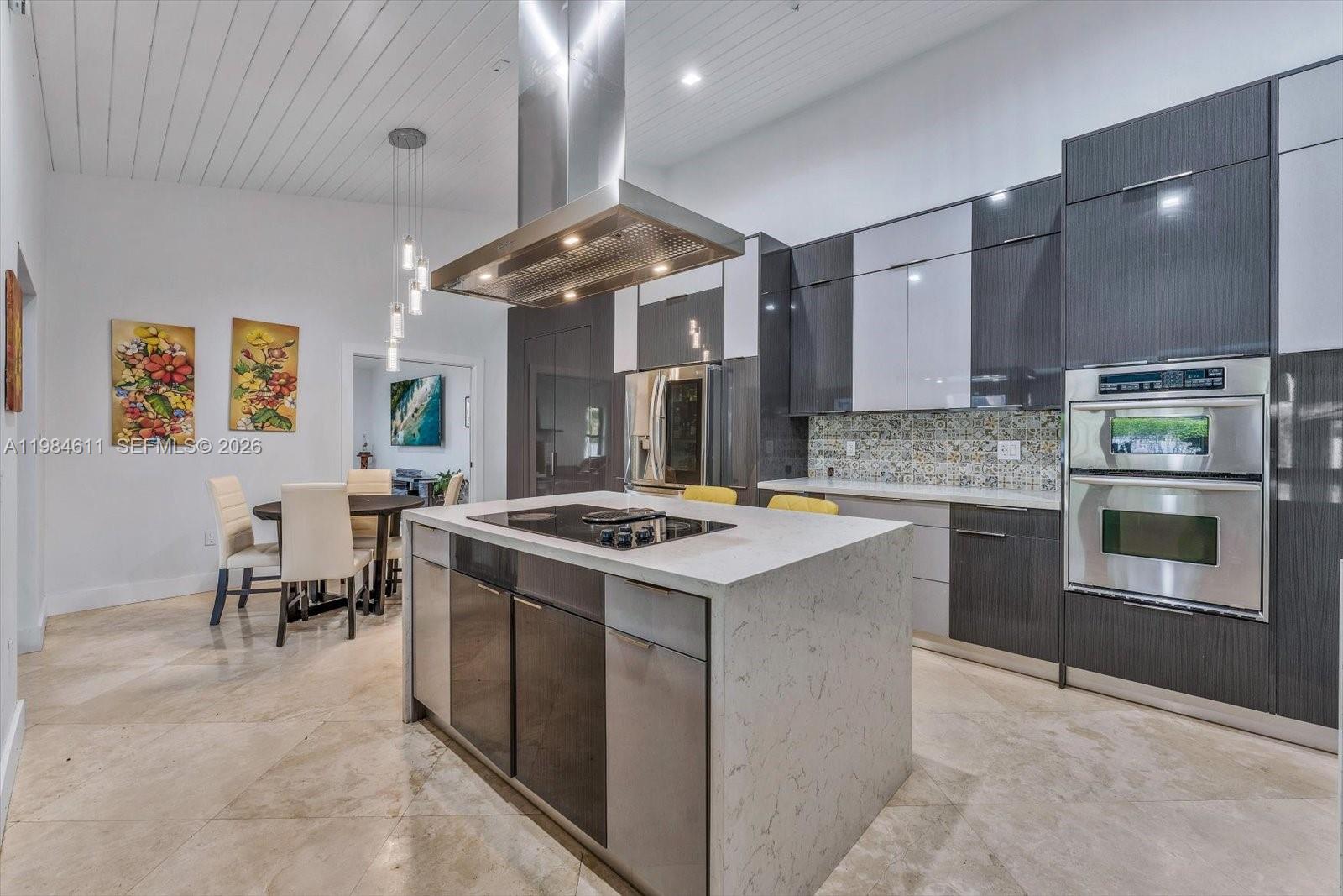 10126 Southwest 93rd Place Miami, FL 33176 - Photo 9 of 27 a kitchen with a stove and a refrigerator
