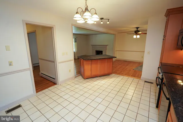 a kitchen with stainless steel appliances a sink stove and cabinets