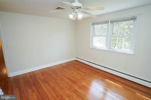 a view of a livingroom with wooden floor