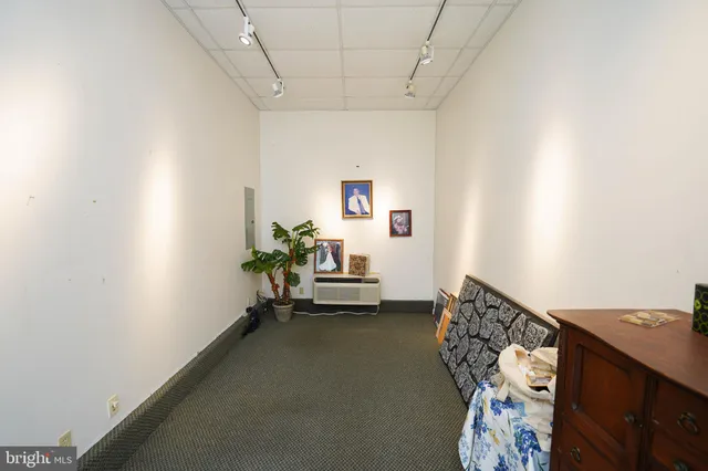 a backyard of a house with lots of green space and fountain