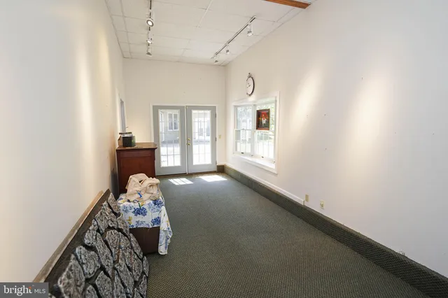 a view of a chair and table in patio of the house