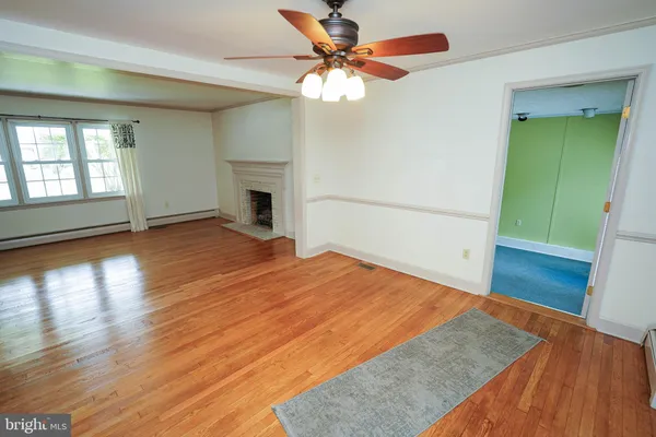 a kitchen with stainless steel appliances kitchen island granite countertop a refrigerator stove top oven and sink