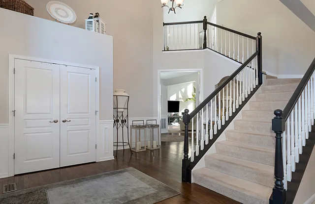 a view of an entryway with wooden floor