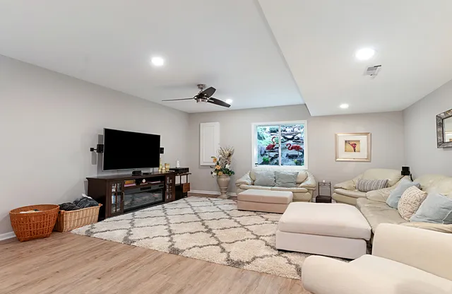 a view of a dining room with furniture and wooden floor