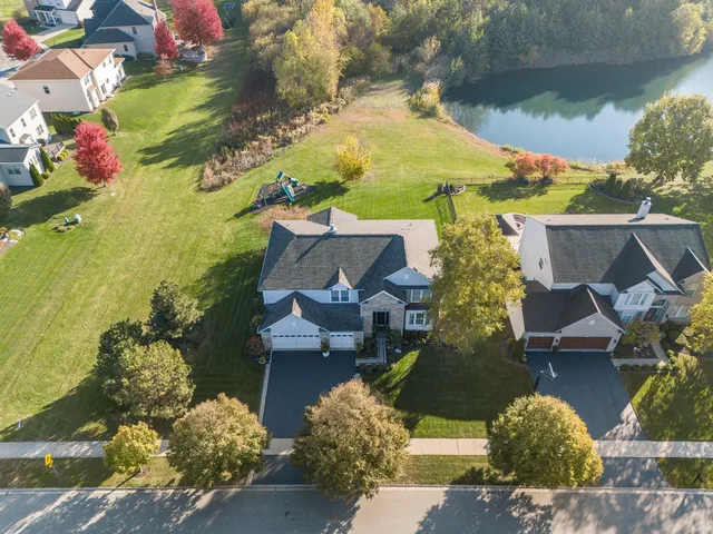 an aerial view of a house having yard