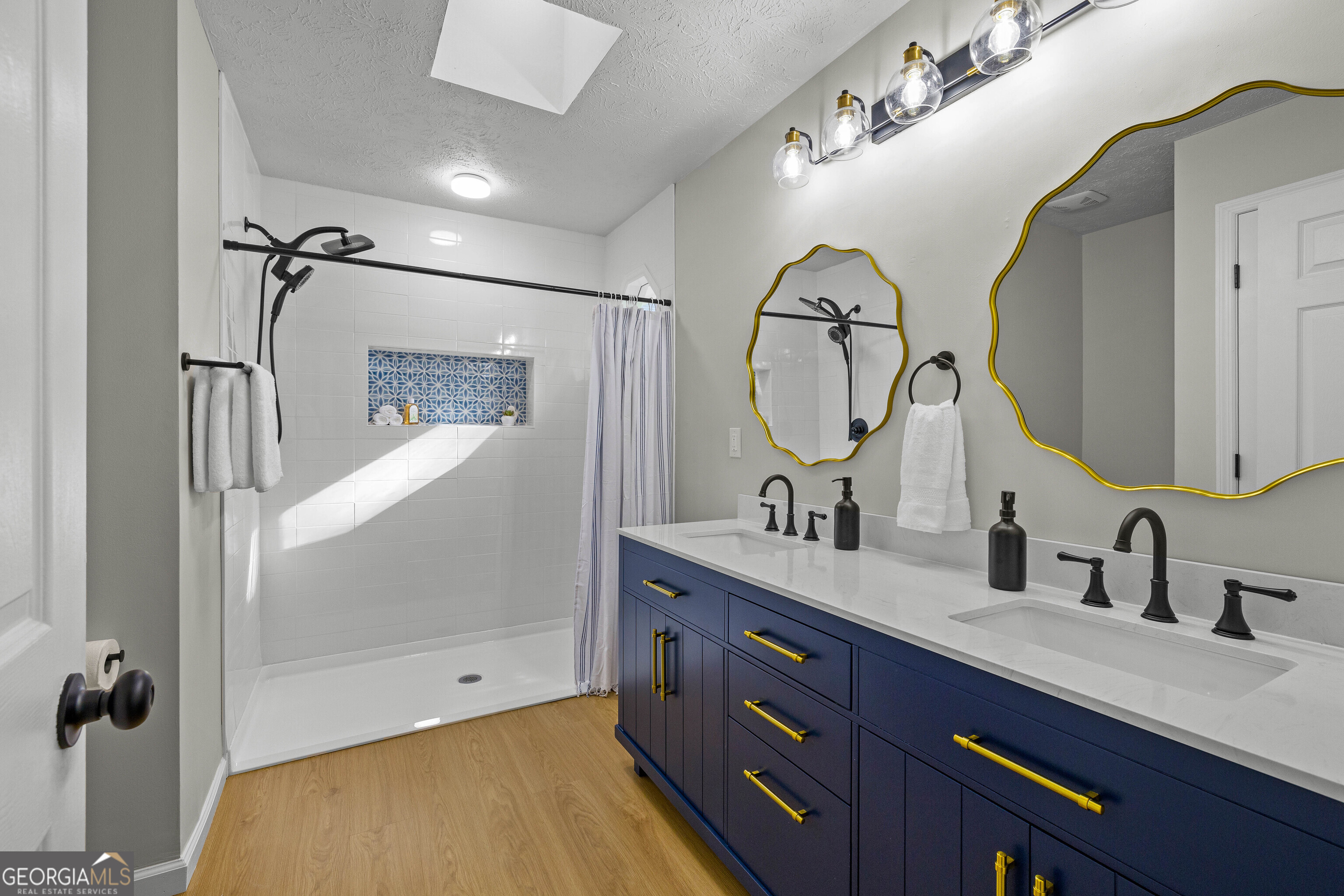 40 River Point Drive LaGrange, GA 30240 - Photo 15 of 22 a bathroom with a double vanity sink and a mirror