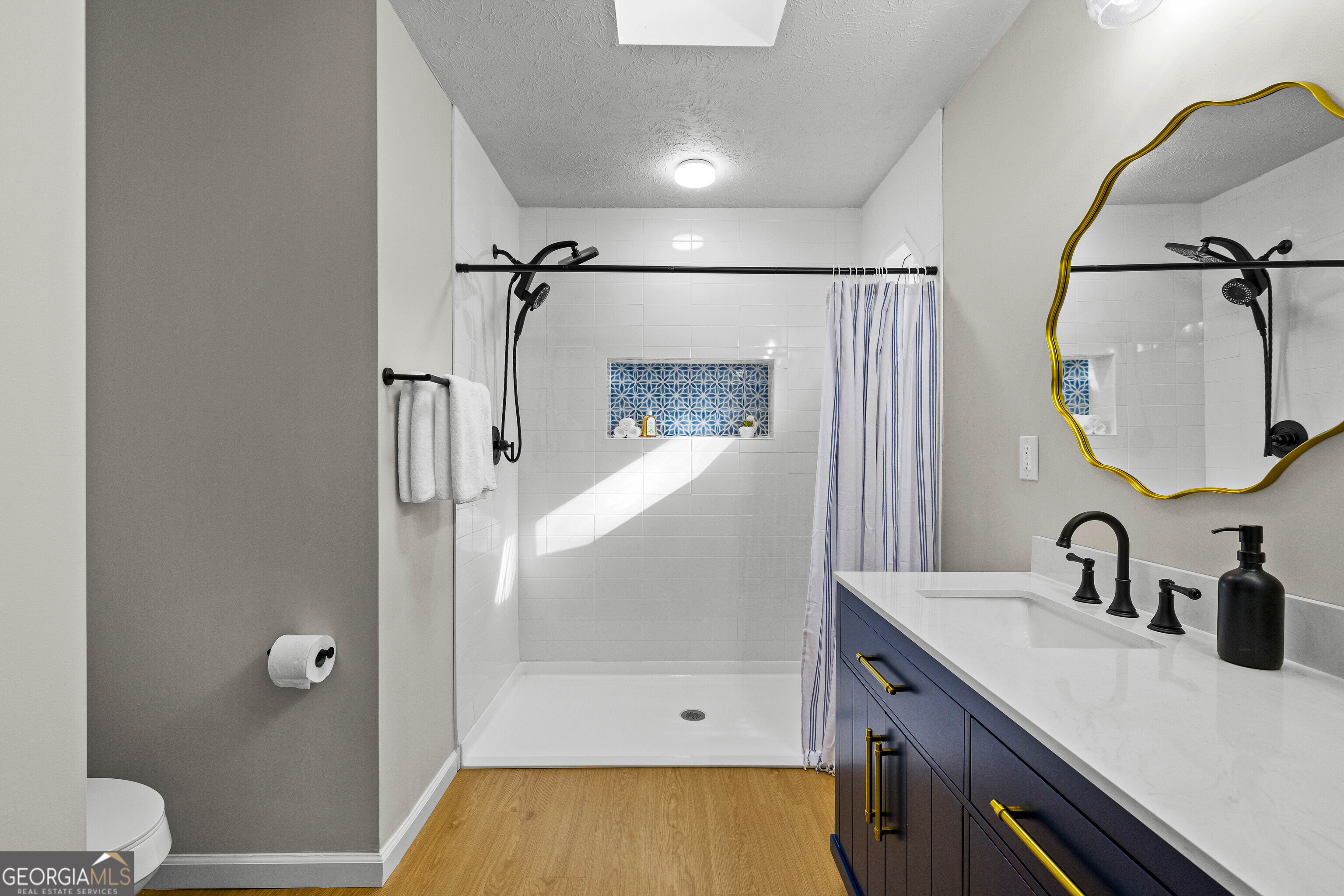 40 River Point Drive LaGrange, GA 30240 - Photo 16 of 22 a bathroom with a sink a toilet and shower