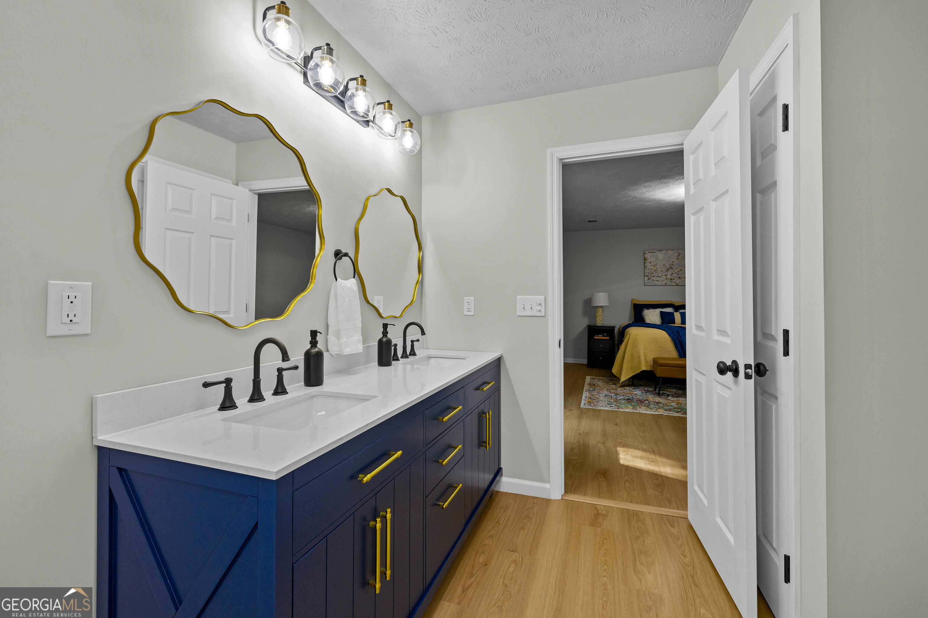 40 River Point Drive LaGrange, GA 30240 - Photo 17 of 22 a en suite bathroom with a double vanity sink and a mirror