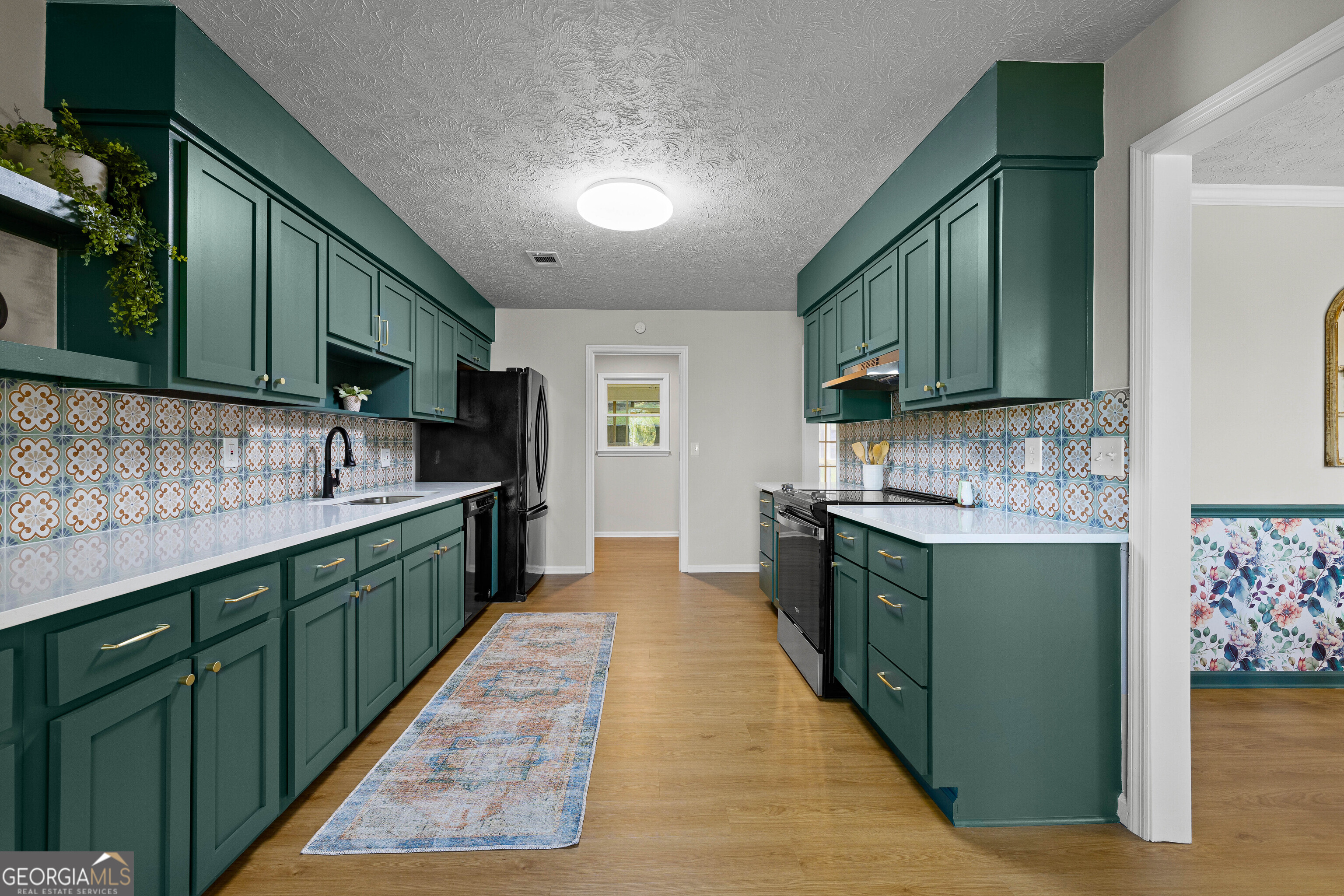 40 River Point Drive LaGrange, GA 30240 - Photo 6 of 22 a kitchen with stainless steel appliances granite countertop a sink stove and cabinets