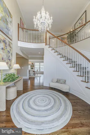 a living room with fireplace furniture and a large window