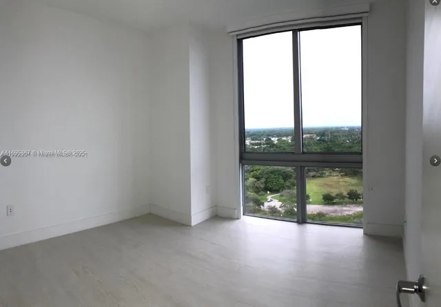 a backyard of a house with a yard and outdoor seating