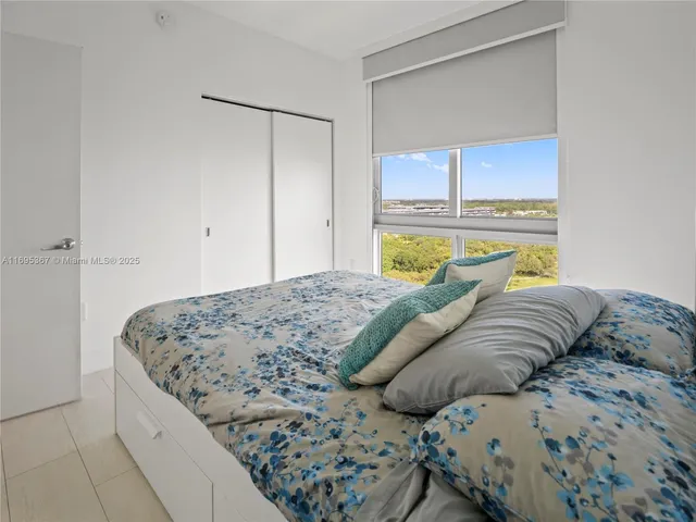 a view of a swimming pool with outdoor seating