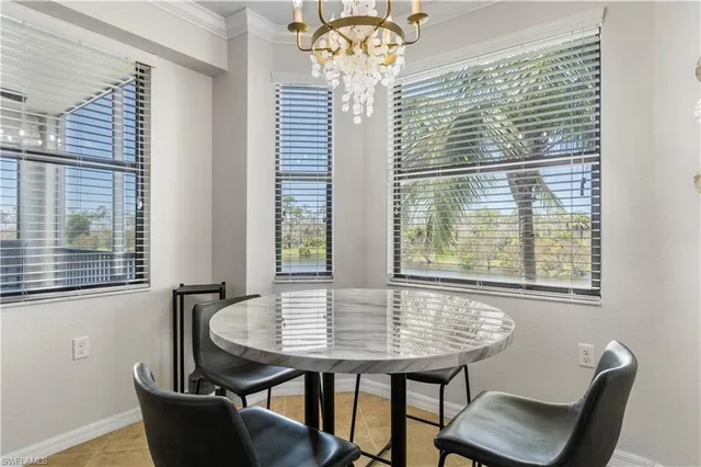 a view of a dining room with furniture and windows