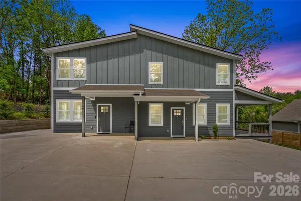 front view of a house with a garden