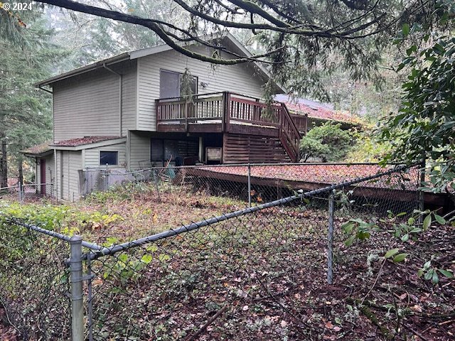 2890 Warren Street Eugene, OR 97405 - Photo 39 of 46 a view of house with a yard and wooden fence