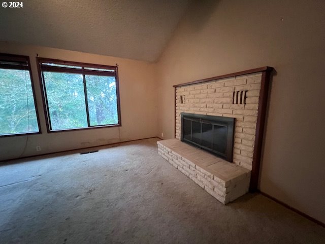 2890 Warren Street Eugene, OR 97405 - Photo 8 of 46 a view of empty room with a fireplace