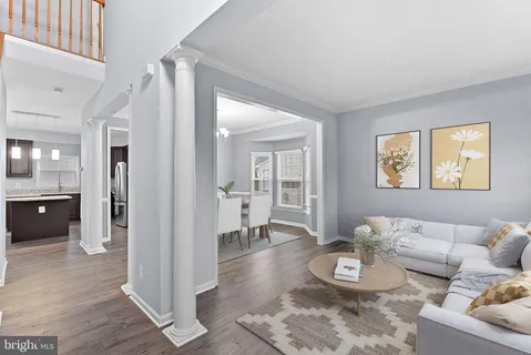 a view of livingroom with hardwood floor and hallway