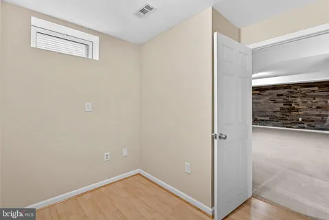 a front view of a house with a yard table and chairs