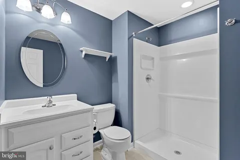 a view of a house with backyard porch and sitting area