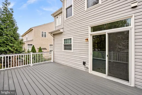 an aerial view of multiple houses with yard
