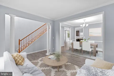 a view of interior and livingroom with wooden floor