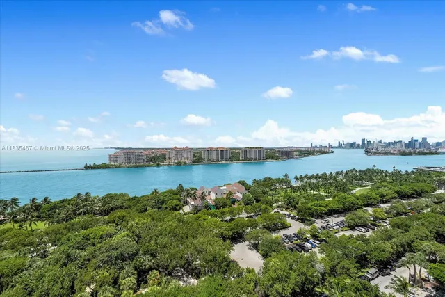 a view of a lake with houses in the back