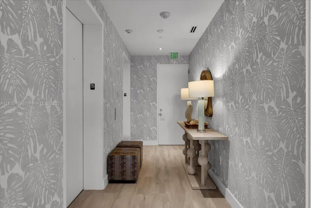 a view of a hallway with seating area