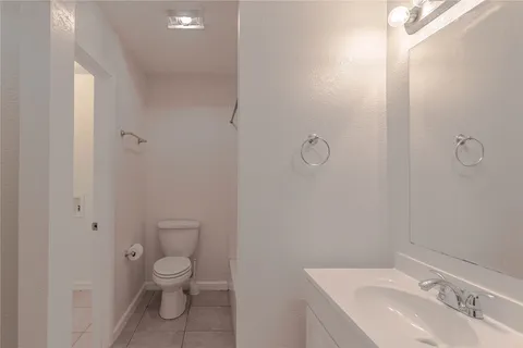 a bathroom with a sink toilet and vanity