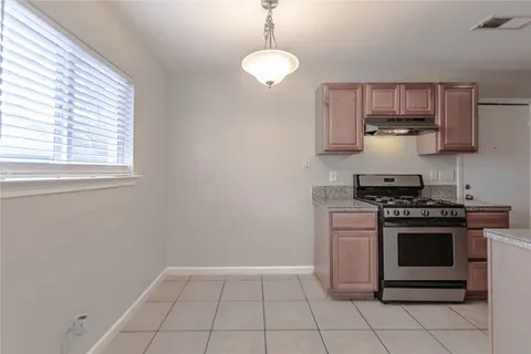 a kitchen with a stove and a microwave