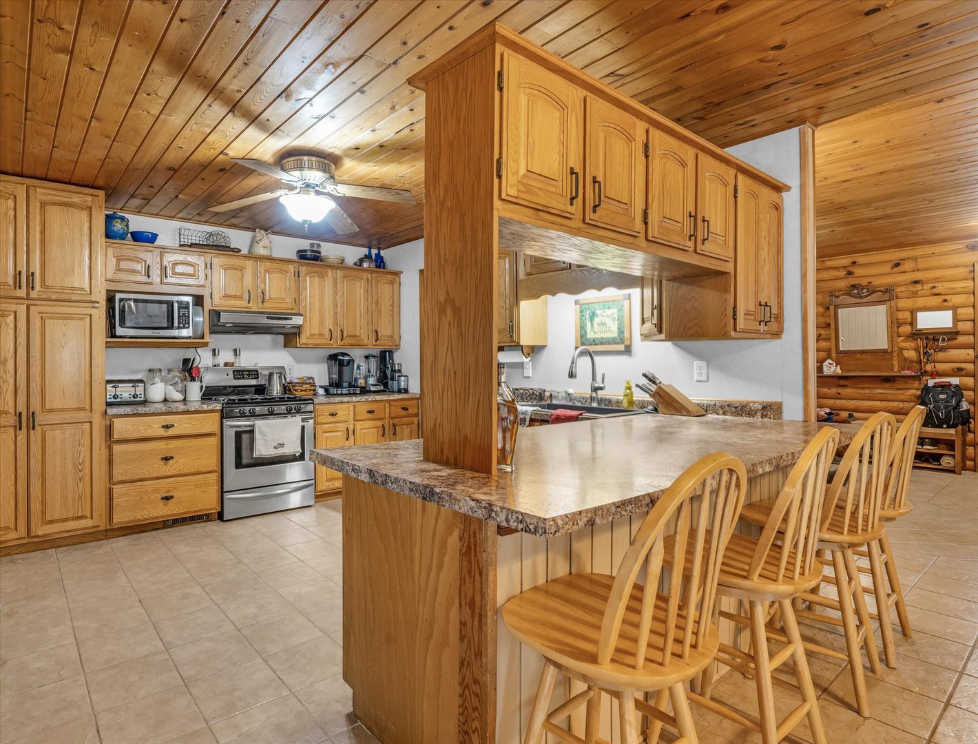 15262 North 450 East Road Fithian, IL 61844 - Photo 23 of 66 a kitchen with stainless steel appliances kitchen island granite countertop a refrigerator and cabinets