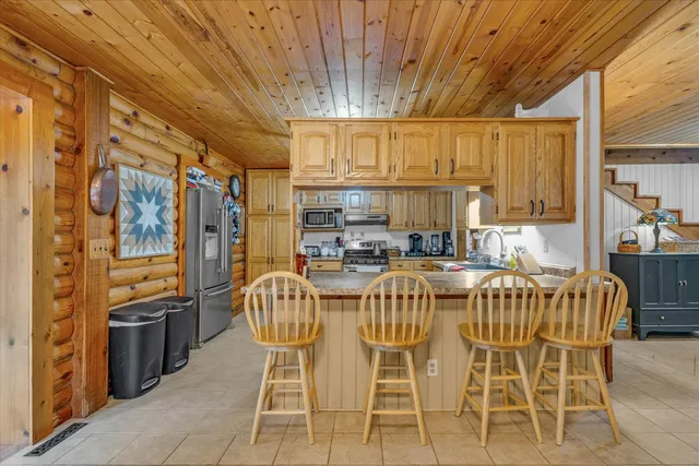 a bedroom with a bed and flat screen tv