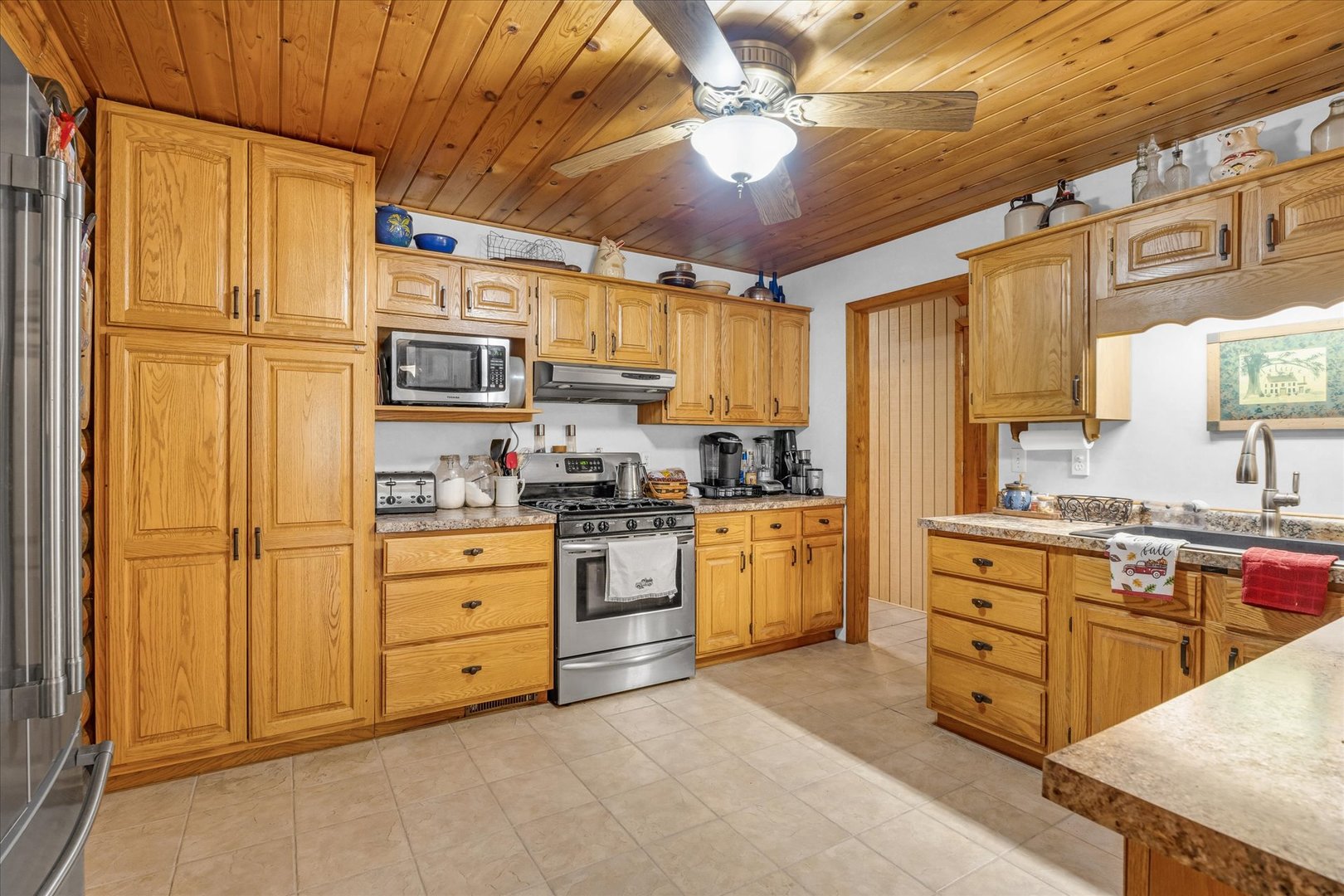 15262 North 450 East Road Fithian, IL 61844 - Photo 28 of 66 a kitchen with stainless steel appliances granite countertop a stove sink and cabinets