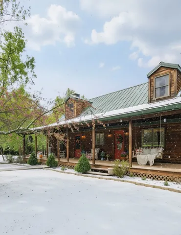 a view of a porch with a table and chairs