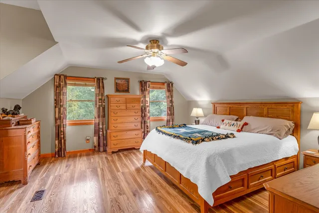 a bedroom with a bed and a dresser