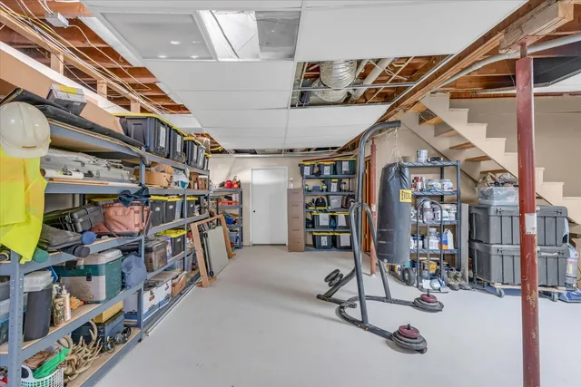 a front view of house with swimming pool and green space