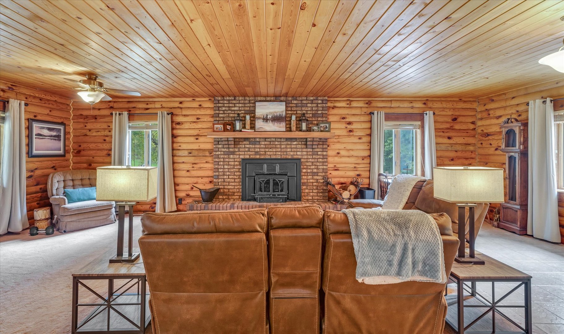 15262 North 450 East Road Fithian, IL 61844 - Photo 9 of 66 a living room with furniture a fireplace and large windows