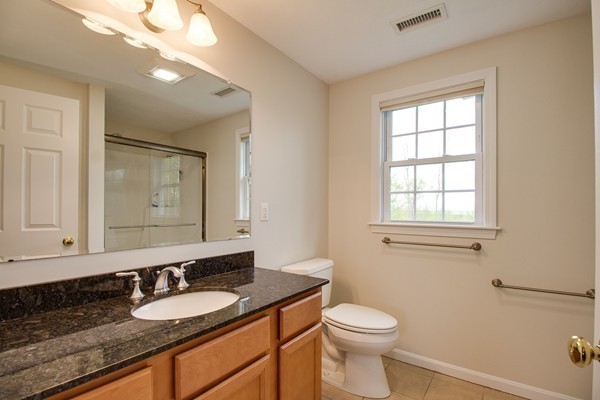 13 Clealand Circle Rutland, MA 01543 - Photo 20 of 30 a bathroom with a granite countertop sink toilet and mirror