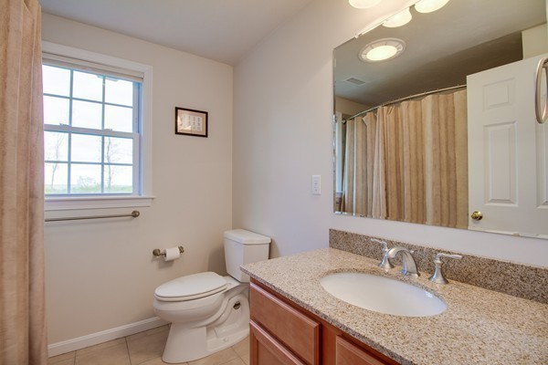 13 Clealand Circle Rutland, MA 01543 - Photo 22 of 30 a bathroom with a granite countertop sink toilet and mirror