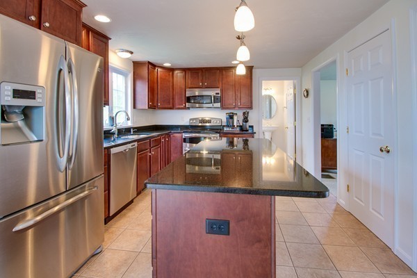 13 Clealand Circle Rutland, MA 01543 - Photo 6 of 30 a kitchen with stainless steel appliances granite countertop a refrigerator a stove and a sink