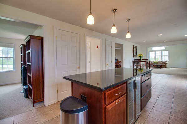 13 Clealand Circle Rutland, MA 01543 - Photo 8 of 30 a kitchen with stainless steel appliances granite countertop a sink a stove and a refrigerator