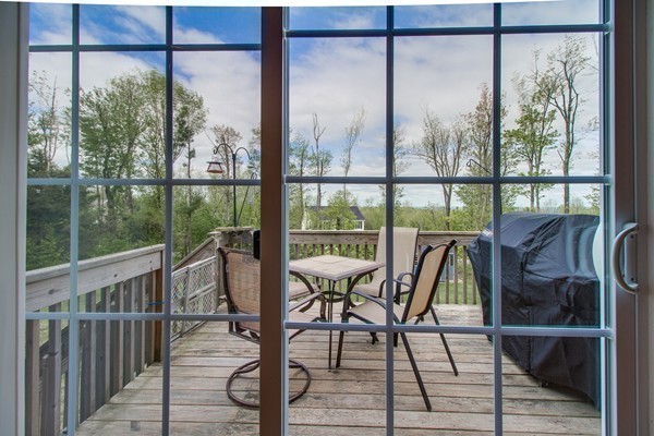 13 Clealand Circle Rutland, MA 01543 - Photo 9 of 30 a view of a balcony with chairs and wooden floor